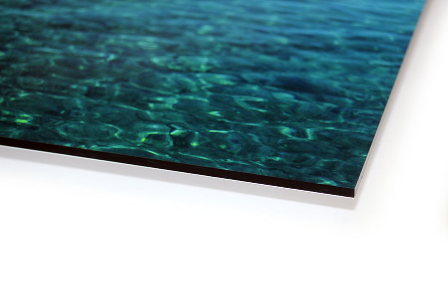 Polished acrylic photo panel edge showing clarity and depth