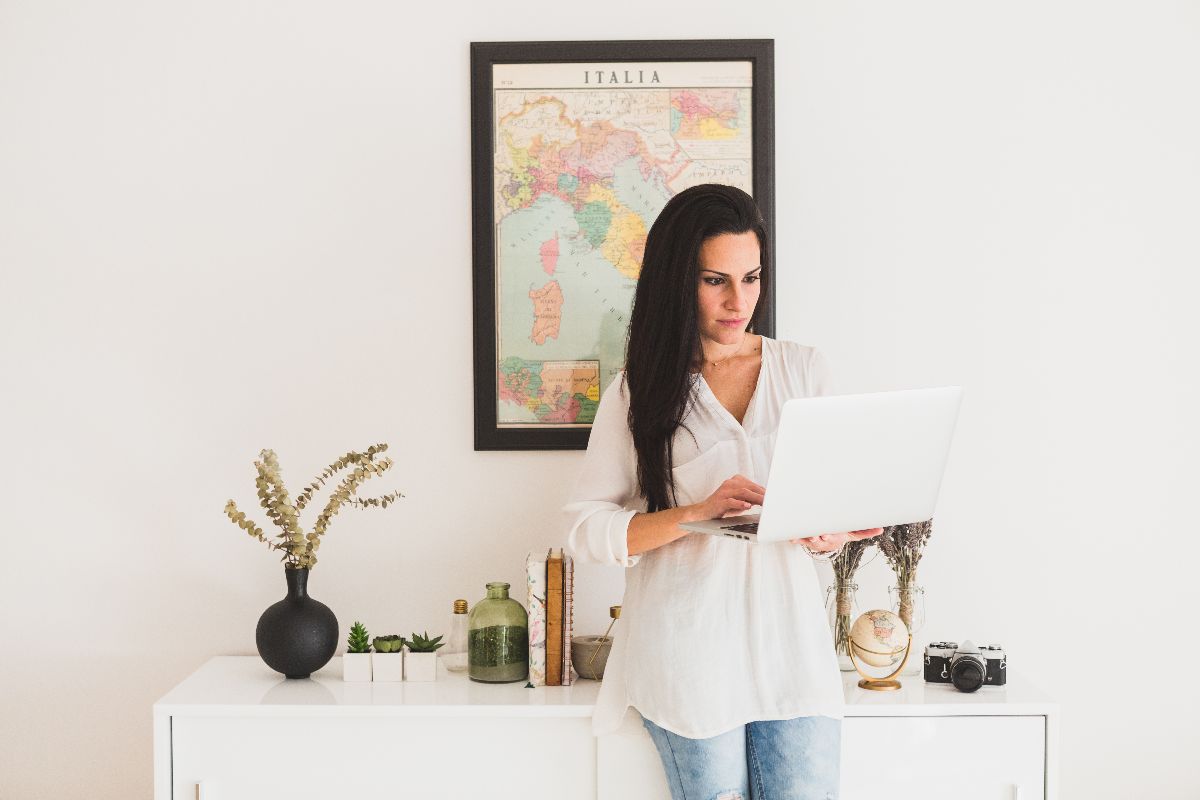 Woman shopping to buy picture frames online in Australia with framed artwork on wall