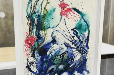 artwork in white frame